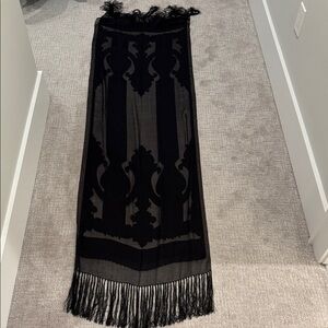 Large black tasseled semi-sheer black-on-black cutout scarf